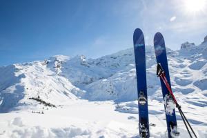 a pair of skis are standing in the snow at Hotel Schweizerhof in Engelberg