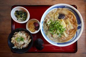 a tray of food with a bowl of soup and rice at HOTEL MYTH-WA -ホテル マイス ワ- adult only in Wakayama
