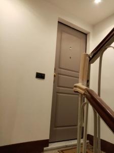a door in a room next to a staircase at Casa D'amore in Riomaggiore