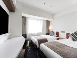 Ένα ή περισσότερα κρεβάτια σε δωμάτιο στο HOTEL MYSTAYS Sapporo Station +48 φωτογραφίες