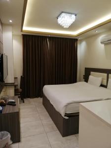 Letto o letti in una camera di Seven Days Hotel