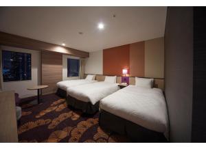Postel nebo postele na pokoji v ubytování Sunshine City Prince Hotel Ikebukuro Tokyo