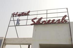 a sign on the top of a building at HOTEL SHREESH KOLKATA in Kolkata