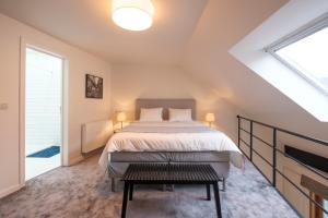 Ένα ή περισσότερα κρεβάτια σε δωμάτιο στο Functional housings 2 steps from Grand Place