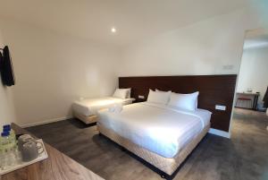 Postel nebo postele na pokoji v ubytování T Hotel Tandop + 21 fotografií