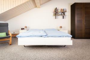 Letto o letti in una camera di MyBednBreakfast in Bottmingen