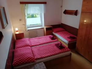 Postel nebo postele na pokoji v ubytování Penzion Rudolfovna