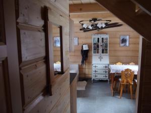 a room with a table and a dining room at Misia Chata in Zakopane