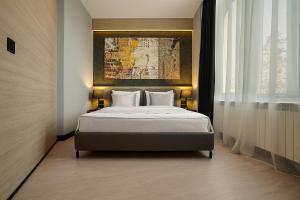 Postel nebo postele na pokoji v ubytování Maccani Black Luxury Suites