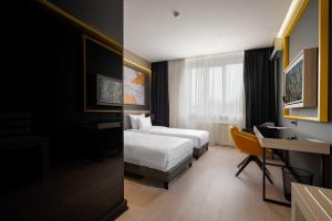 Postel nebo postele na pokoji v ubytování Maccani Black Luxury Suites