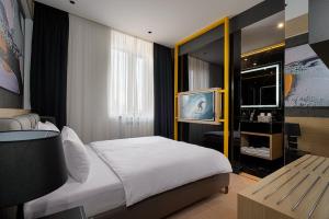 Postel nebo postele na pokoji v ubytování Maccani Black Luxury Suites
