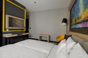Postel nebo postele na pokoji v ubytování Maccani Black Luxury Suites
