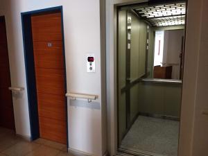 a door in a hallway with a mirror at Apart Zeta in Belén de Escobar