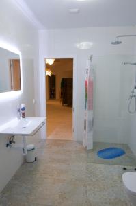 a white bathroom with a sink and a shower at Loft Valentia Tous Calpe in Calpe