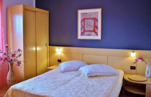 Postel nebo postele na pokoji v ubytování Apartman Balen J.