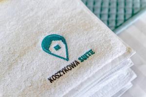 Certifikát, ocenenie alebo iný dokument vystavený v ubytovaní Koszykowa Suite - apartament w centrum Warszawy!