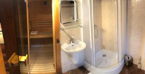 a bathroom with a sink and a shower at Chalupa Alzbeta in Liptovský Ján +45 photos