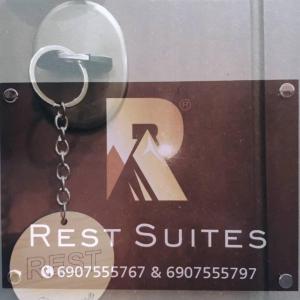 a key chain with a sign that says rest suites at REST SUITE On The Pedestrian Street in Kalavrita