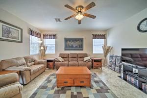 a living room with couches and a ceiling fan at Goodyear Home with Pool, 2 Mi to Goodyear Ballpark in Goodyear