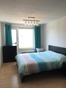 Postel nebo postele na pokoji v ubytování Advice & Advise Apartment