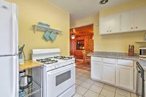 a kitchen with a white stove top oven at Williams Bay Retreat Walk to Lake Geneva and Town! in Lake Geneva