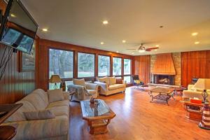 a living room with a couch and a fireplace at Spacious South Haven Home about 1 Mi to Lake Michigan! in South Haven