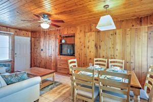 a dining room with a table and a ceiling fan at Williams Bay Retreat Walk to Lake Geneva and Town! in Lake Geneva