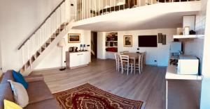 a living room with a couch and a table at Heart of Rome Vatican Deluxe New Apartment 1GB WiFi in Rome