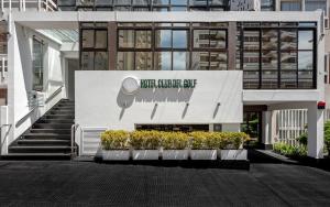 a building with a sign for a music equipment store at Hotel Club del Golf in Mar del Plata