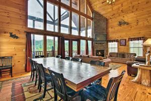 a large dining room with a large table and chairs at Expansive Gatlinburg Cabin Hot Tub, Deck and Grill! in Gatlinburg