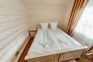 Ένα ή περισσότερα κρεβάτια σε δωμάτιο στο Cottage Diamant Y&M +38 φωτογραφίες