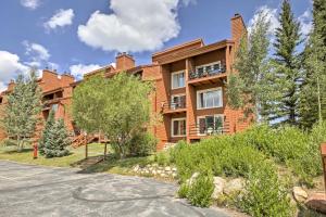 an apartment building with a driveway at Silverthorne Condo Patio, Mtn Views, Pool Access! in Silverthorne