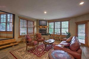 a living room filled with furniture and a flat screen tv at Mountain Condo Half Mi to Breckenridge Ski Slopes in Breckenridge