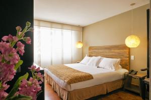 Katil atau katil-katil dalam bilik di Hotel Retiro 84 by MIJ