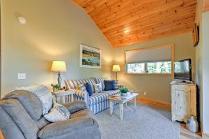 a living room with a couch and a tv at Waterfront Prospect Harbor Cottage Yard, Fire Pit in Prospect Harbor