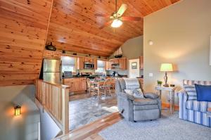 a living room and kitchen with a ceiling fan at Waterfront Prospect Harbor Cottage Yard, Fire Pit in Prospect Harbor