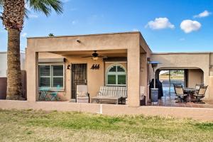 a house with a patio and a palm tree at Golf Escape with Patio, Pool Access and Entertainment! in Mesa