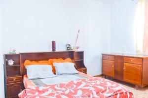 Postel nebo postele na pokoji v ubytování La Caverna House