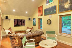 a living room with a leather couch and chairs at Pet-Friendly Pennsylvania Vacation Rental with Pool! in Laughlintown