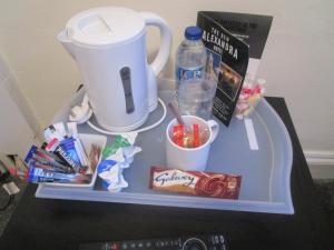 a tray with snacks and a blender on a table at The New Alexandra Hotel in Llandudno