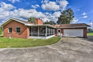 a brick house with a garage and a driveway at Sandford Vacation Rental Near Airport and Lake! in Sanford