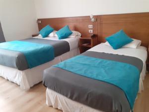 Ένα ή περισσότερα κρεβάτια σε δωμάτιο στο Hotel Real
