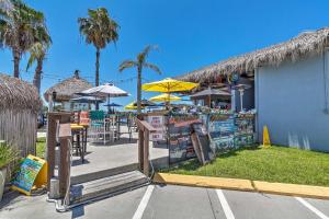 a restaurant with tables and chairs and umbrellas at Riverfront Homosassa Retreat with Kayak and Boat Dock! in Homosassa