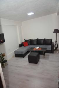 a living room with a couch and a table at My Place Lux Apartament in Ohrid