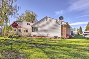 a house in a yard with a house at Ashton Escape with Yard 56 Mi to West Yellowstone! in Ashton