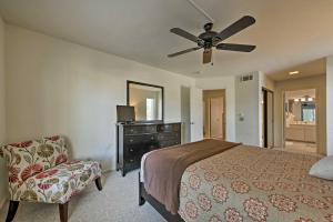 a bedroom with a bed and a ceiling fan at Cathedral City Condo with Pool, 7 Mi to Palm Springs in Cathedral City +16 photos
