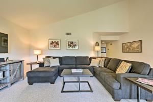 a living room with a couch and a table at Cathedral City Condo with Pool, 7 Mi to Palm Springs in Cathedral City