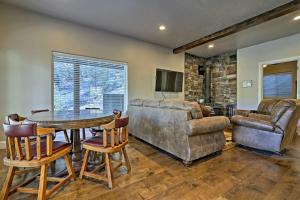 a living room with a table and a couch at Mammoth Creek Apt Between Bryce Canyon and Zion! in Hatch