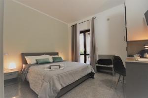 Postel nebo postele na pokoji v ubytování ValpoHome&Rooms