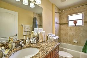 a bathroom with a sink and a toilet and a tub at Spacious Port St Lucie Home Near PGA Village! in Port Saint Lucie +19 photos